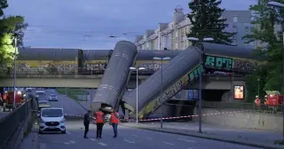 Munich freight-train derailment leaves one dead as cars plunge onto street