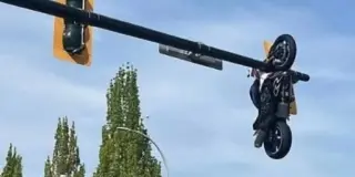BMW Crash Flings Motorcycle Into Air, Sticks It on Delta Traffic Light