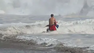 Teen lifeguard braves brutal surf to rescue boy swept out to sea