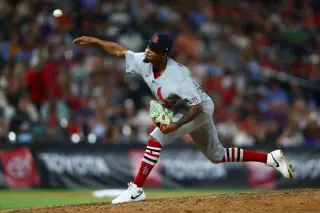 Hat-spotlight clash: Marmol ejected as Rincon debuts for Cardinals