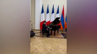 Macron Sings Aznavour as Armenia’s PM Joins on Drums