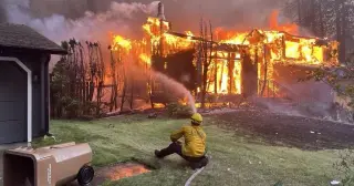 Spokane County wildfire pushes crews to the limit as 150-foot flames surge