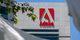 Adobe Stock Dips After Strong Earnings Amid AI Rivalry and Leadership Shift