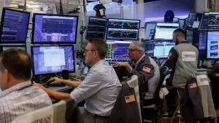 Oil slide lifts markets but risks linger over optimistic rally