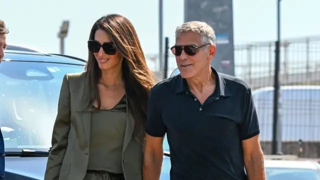 Amal Clooney Stuns in Satin Shorts and Divisive Heels at Venice Airport