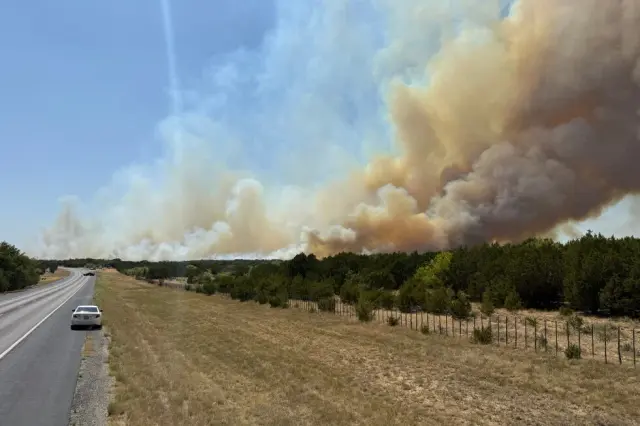 Wildfires push evacuations across Texas and Nevada as flames threaten homes