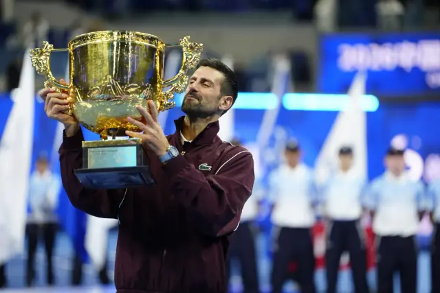 Djokovic Secures 102nd Title in Beijing as De Minaur Retires Injured