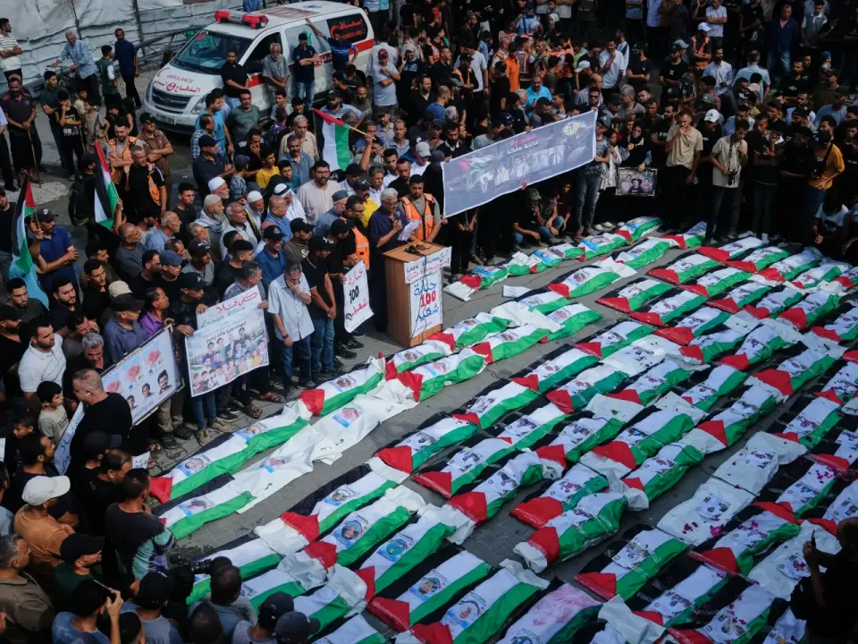 Gaza families bury 100 victims, including 60 children, recovered from Zeitoun rubble