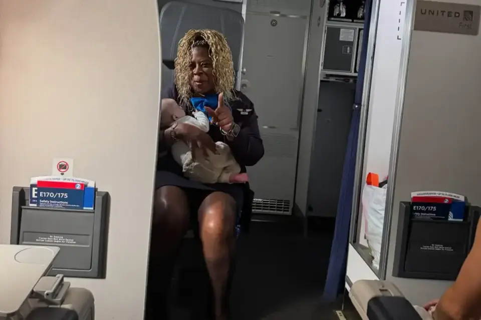 United flight attendant Monique Harris praised for catching infant slipping from exhausted mother’s lap