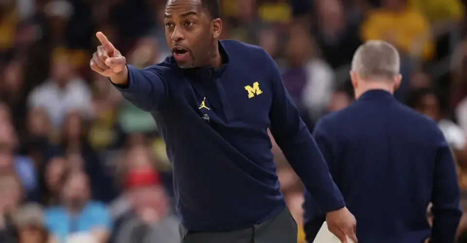 Michigan bets on Boynton's pedigree over Moore's in-house path