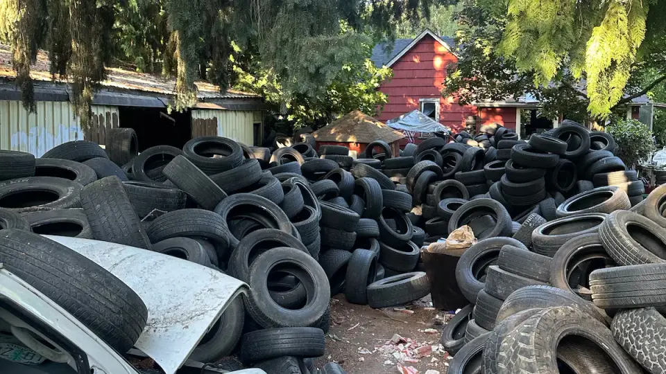 Portland man finds thousands of illegally dumped tires on newly bought land