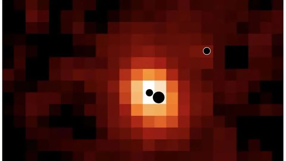 Triple black holes in a distant galaxy reveal rapid early-universe growth