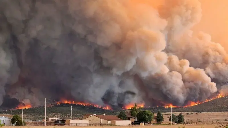 Parched West battles fast-spreading wildfires as dangerous weather lingers