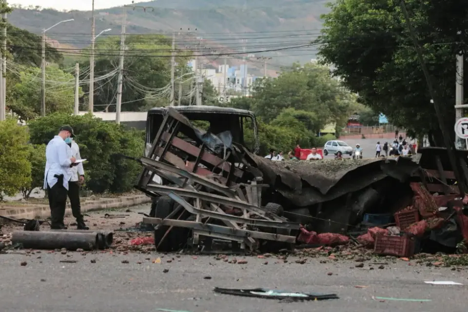Truck blast outside Colombian police base injures 11 officers, kills dog