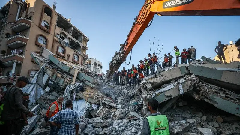 Gaza building collapse leaves at least 21 dead, dozens trapped