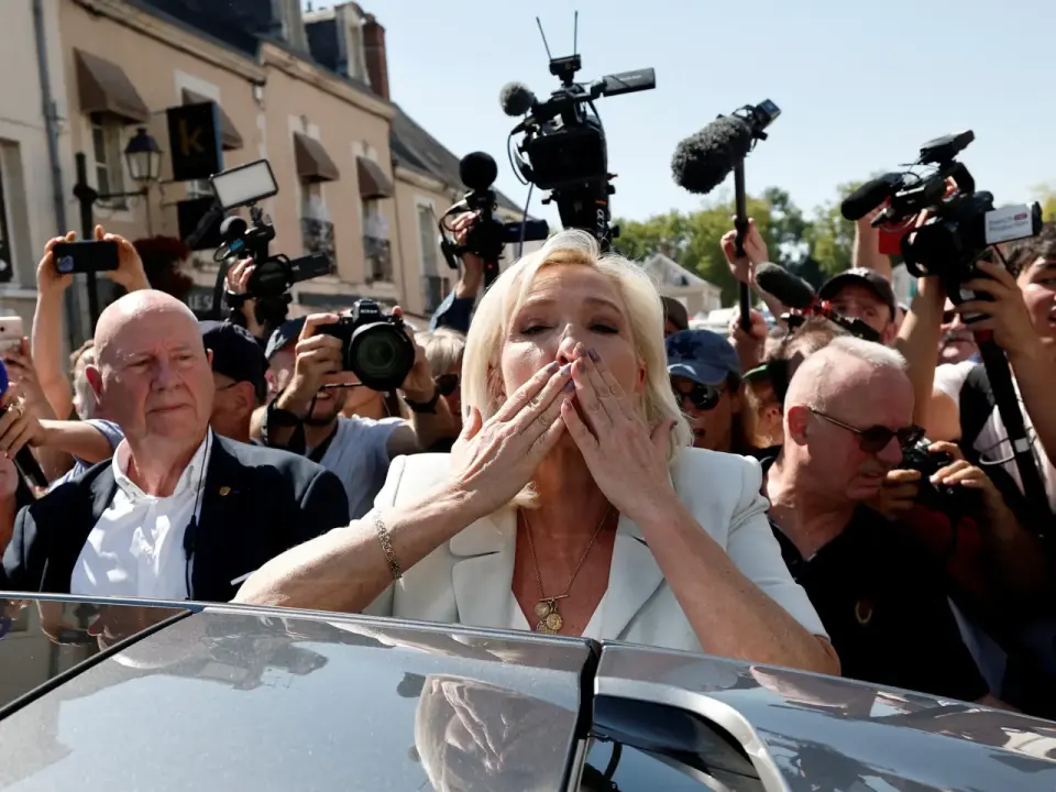 Le Pen presses ahead with 2027 bid, hinting at campaign under ankle monitor