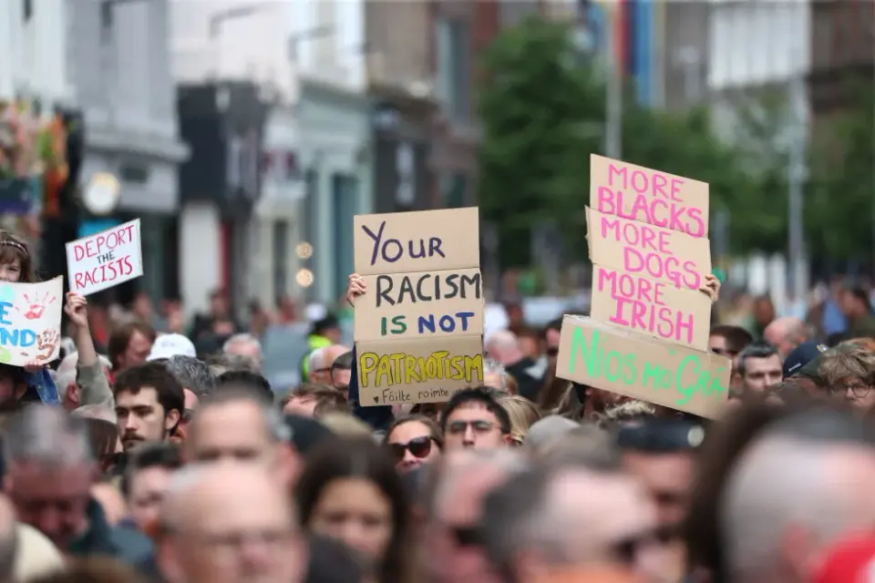 Belfast stands against xenophobia after stabbing spurs anti-immigrant rioting