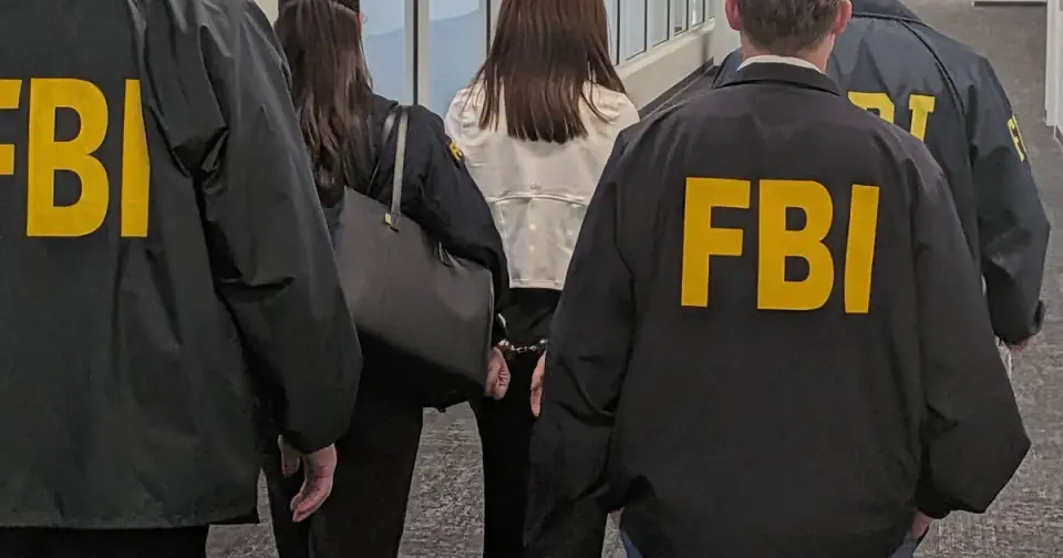 FBI raids home of suspected Chinese spy's accomplice as accused realtor denied bail