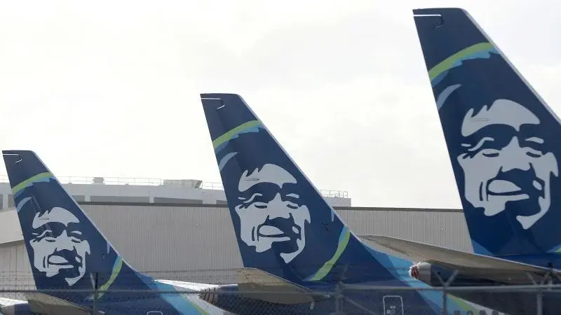 Alaska Airlines flight returns to gate after on-board threats trigger cockpit lockdown