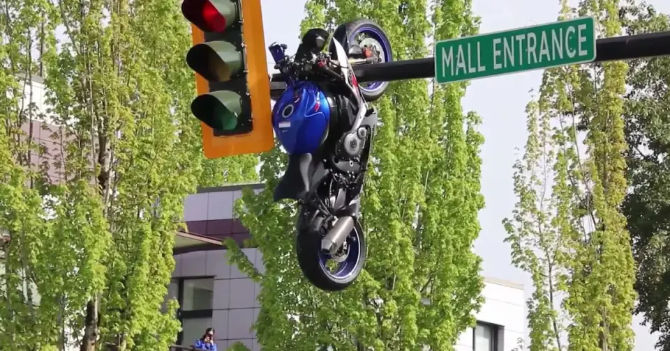 Motorcycle Suspended From Vancouver Traffic Light After Crash