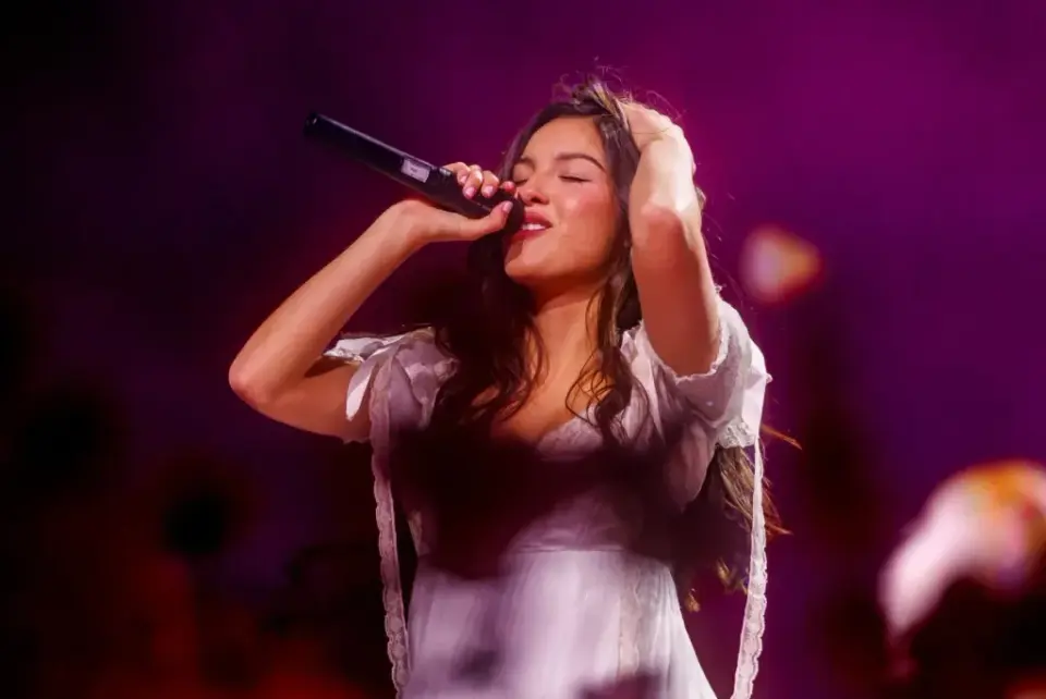Olivia Rodrigo Kicks Off 'Unraveled' Tour with Seasonal Set and Dissolving Dress