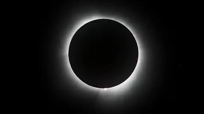 Partial eclipse arrives for Michigan as totality shadows distant skies