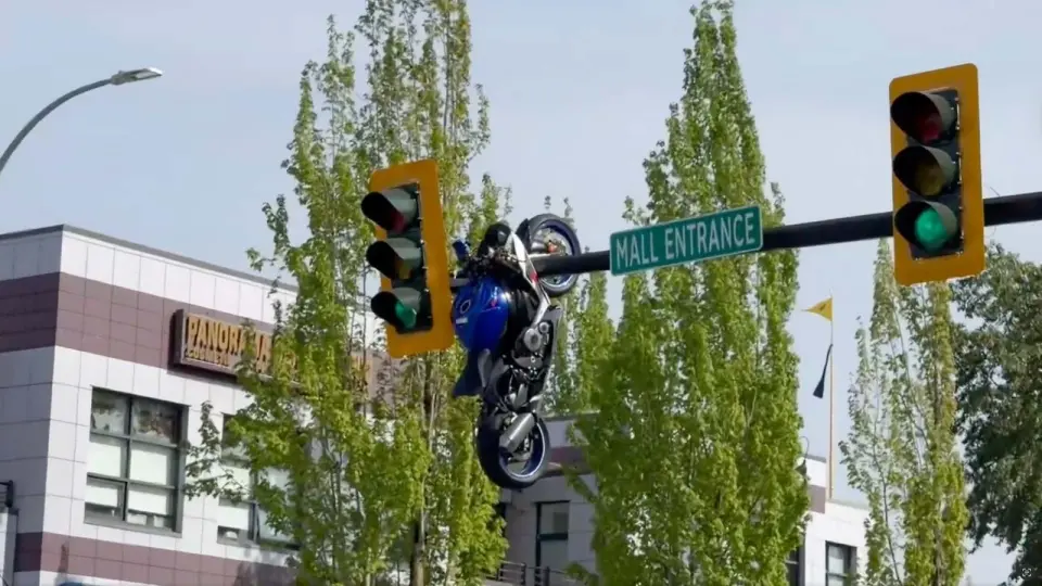 Delta, BC Motorcycle Ends Up Dangling from Traffic Light After Crash