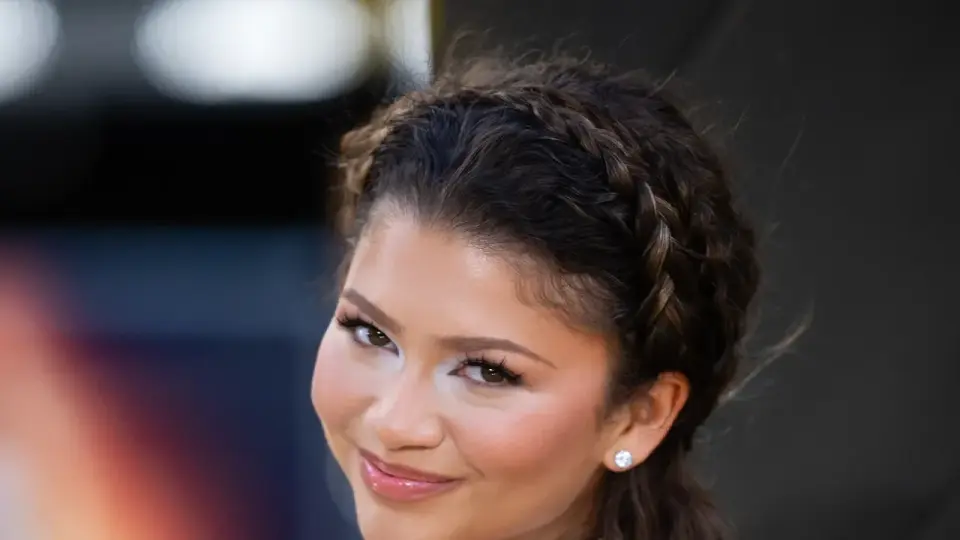 Zendaya Trades Long Waves for a Short Pixie Cut at Prada Event
